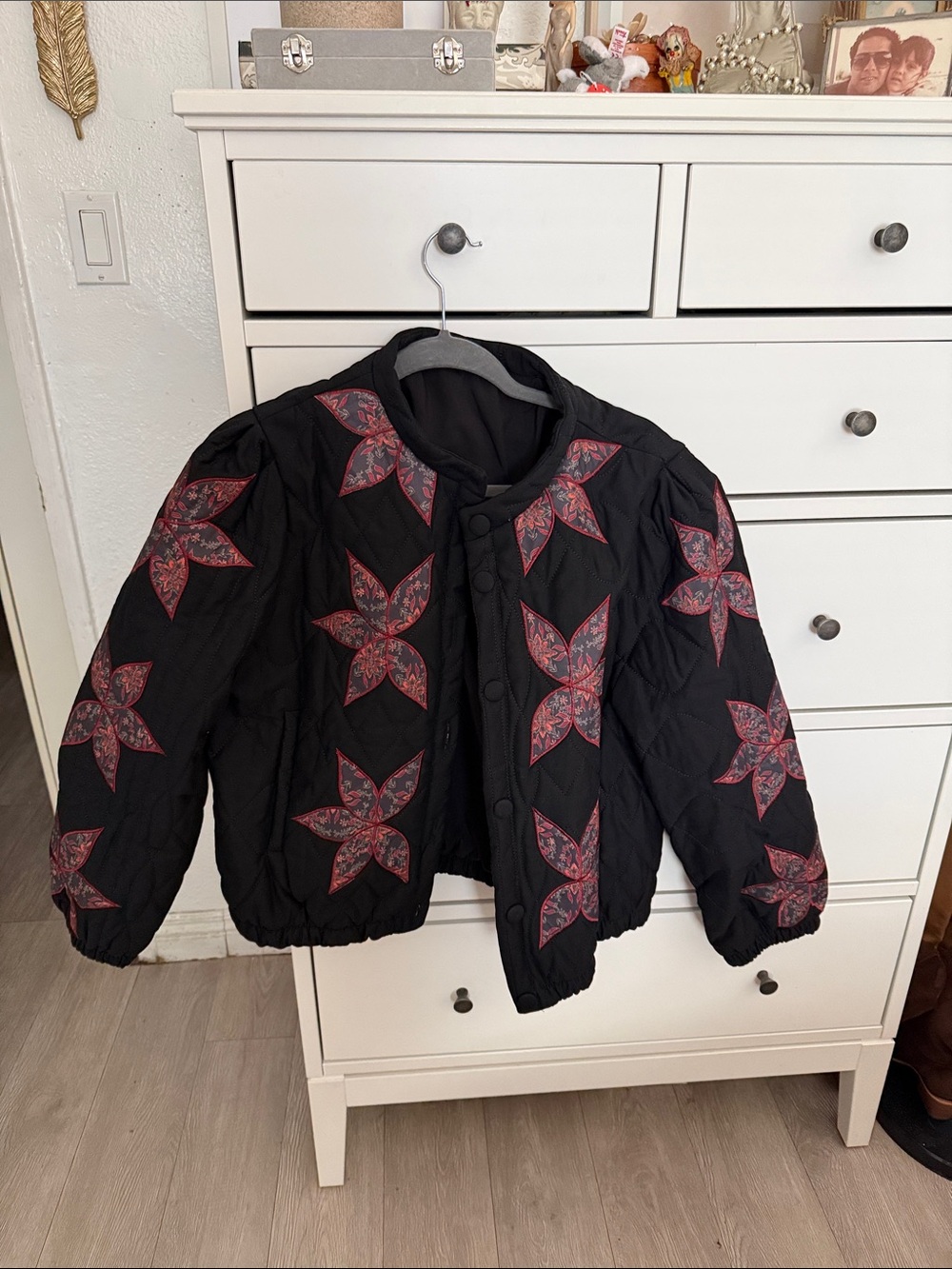 Amazon Black Quilted Puffer Jacket with Red Floral Star Appliqués